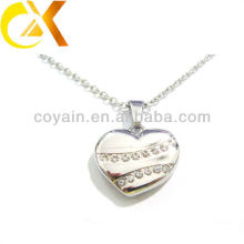 Fabricante 316L joyería de acero inoxidable forma de corazón hueco colgantes para las mujeres
